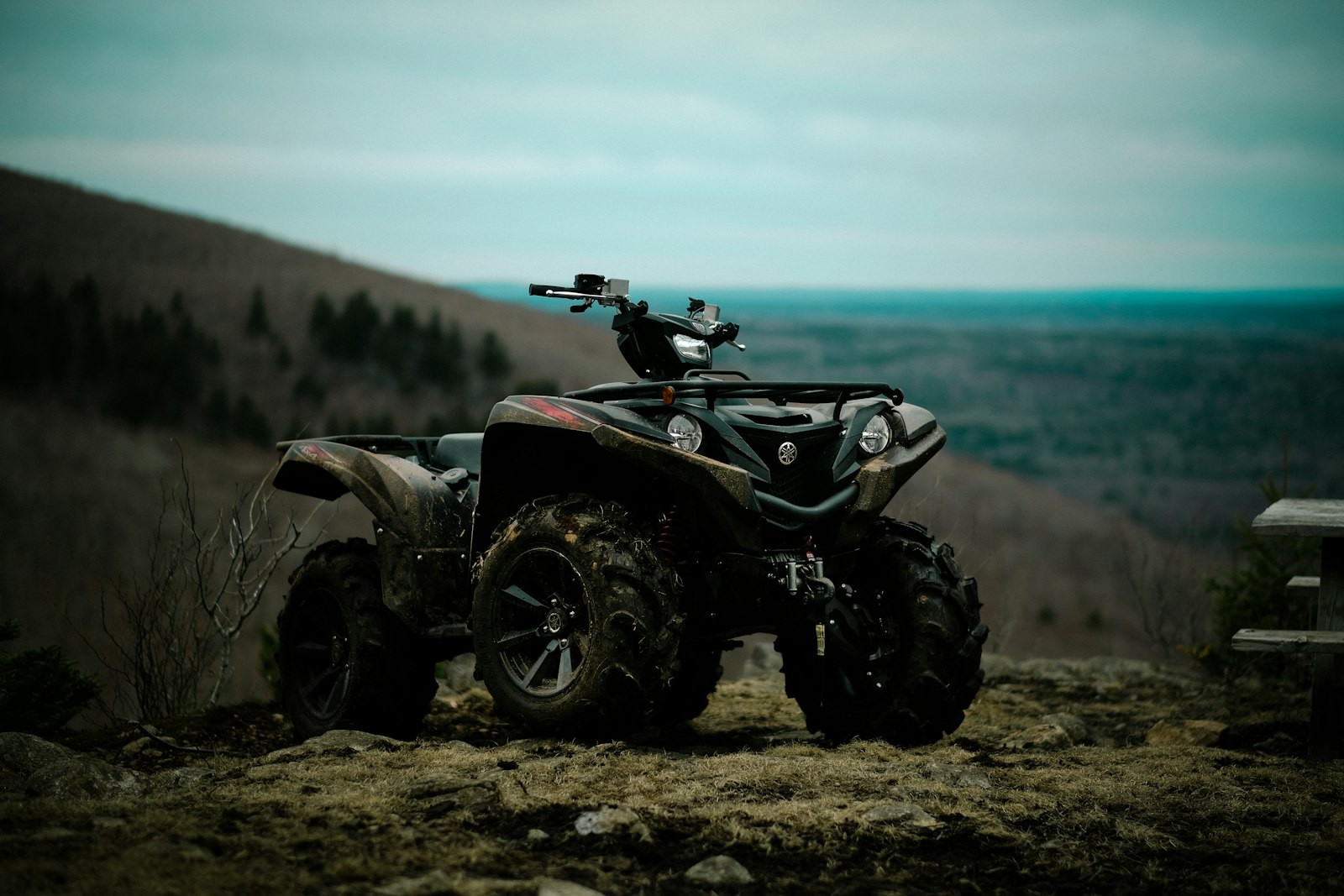 Yamaha ATV parked on a dirt trail